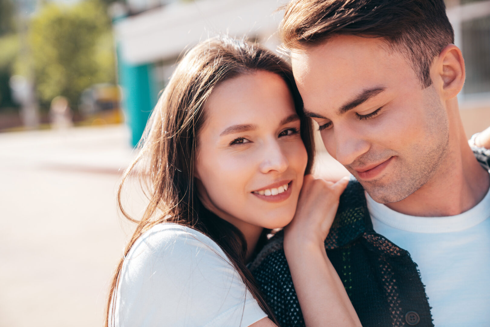 An affectionate young couple embracing outdoors — counseling at Therapy Utah in Lehi, Utah
