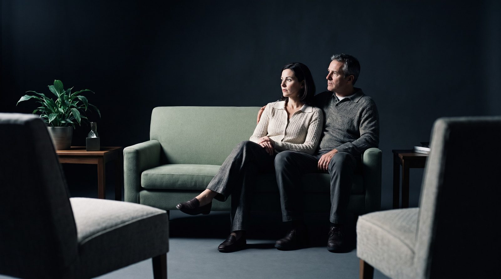 CSAT versus regular couples counseling A couple seated together in a therapist office listening during a counseling session